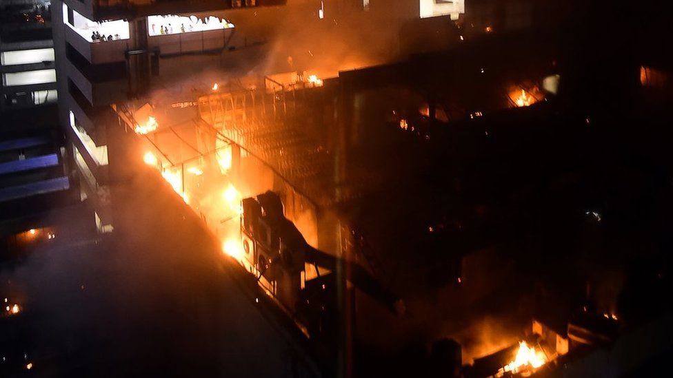 A view of a building on fire where a rooftop party was being held in Mumbai early on 29 December 2017.