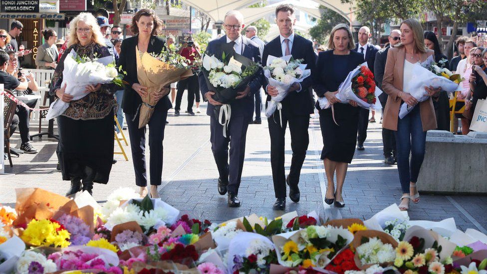 Prime Minister Anthony Albanese and NSW Premier Chris Minns (3rd and 4th from left) were among those laying flowers