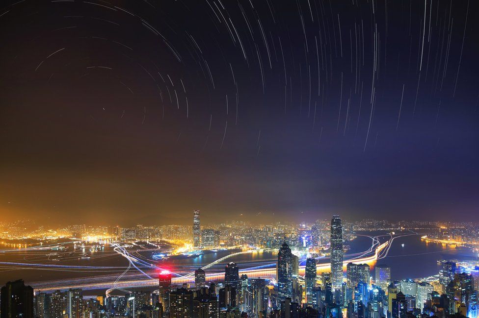 Taken from The Peak, the highest mountain on Hong Kong Island, the image shows the hustle and bustle of the city in contrast to the peaceful starry sky.