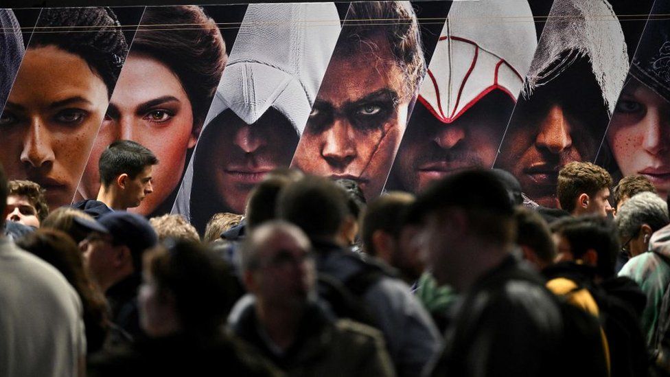 Visitors line up at Ubisoft's "Assassin's Creed" video game booth on the opening day of the "Paris Games Week" in November 2022