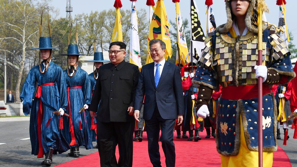Kim Jong-un and Moon Jae-in walk through the DMZ