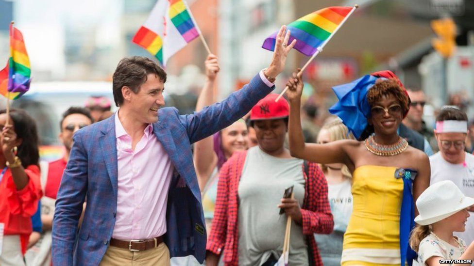 Biko Beauttah (right) with Justin Trudeau during Toronto's Pride parade
