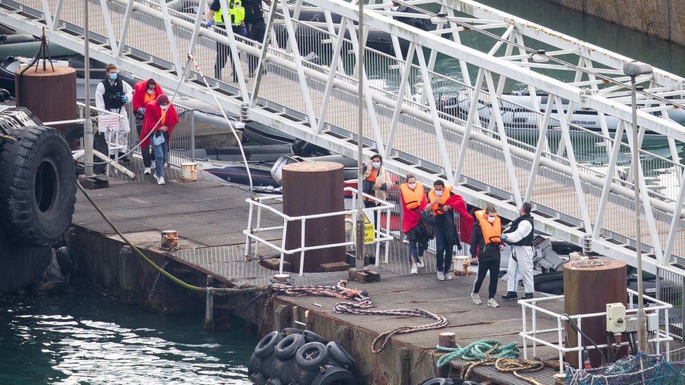 A group of people, thought to be migrants are brought into Dover by Border Force officers on Wednesday after crossing the English Channel.