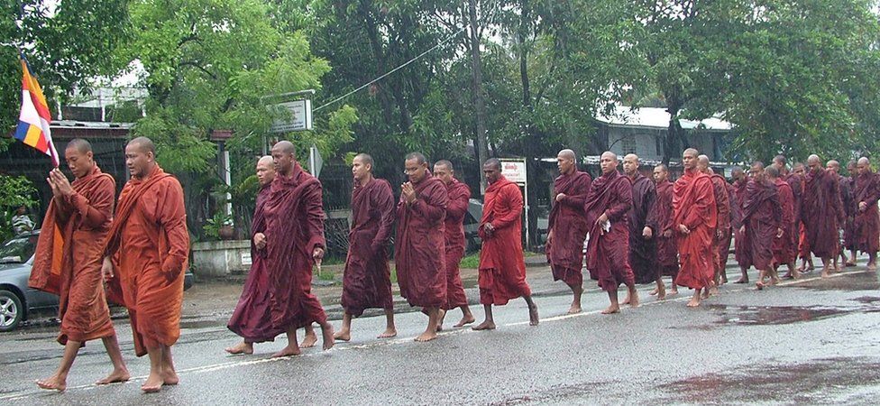 Buddhist monks march in the rain along Waizayantar Road in the Yangon suburb of Ahlone on 19 September 2007.