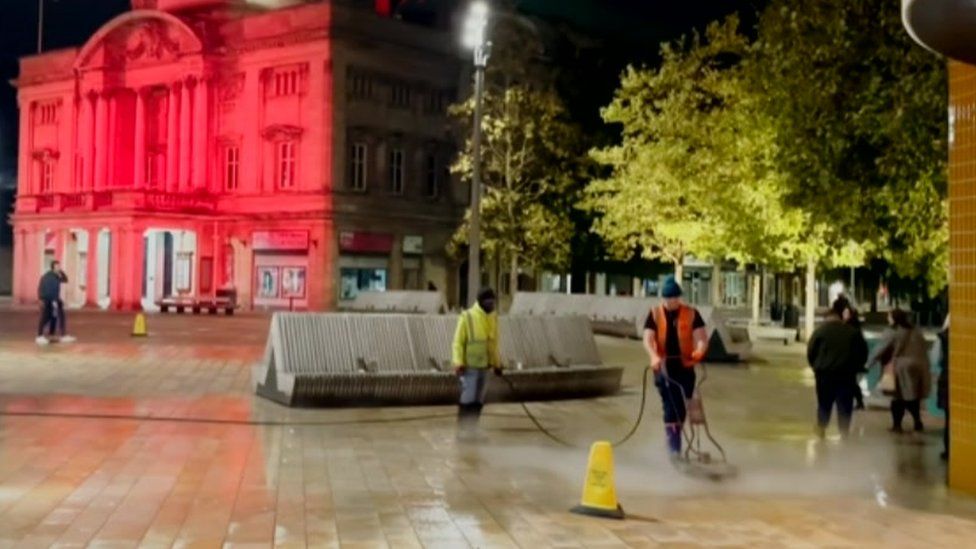 Council workers remove chewing gum from Queen Victoria Square