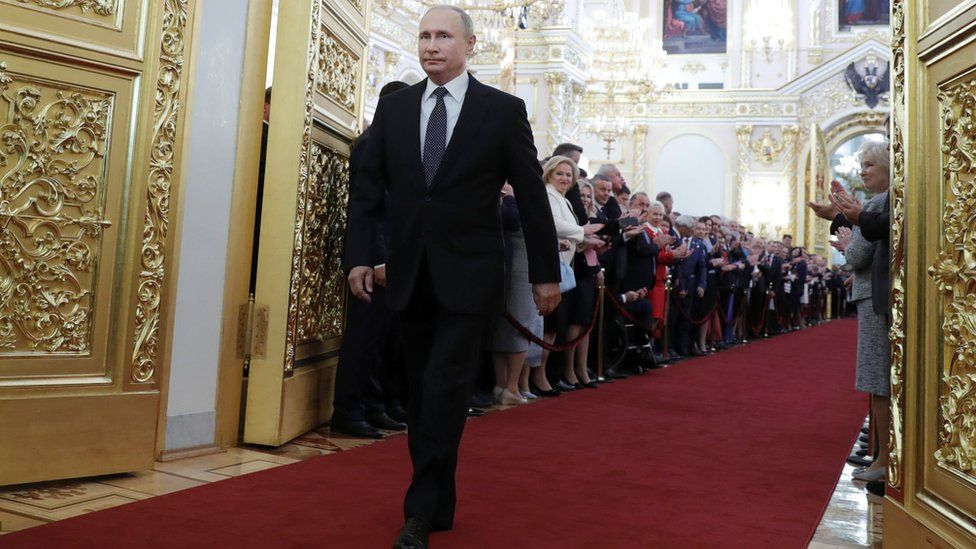 Russian President Vladimir Putin walks before an inauguration ceremony at the Kremlin in Moscow, Russia May 7, 2018