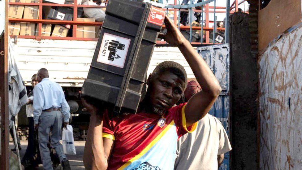 Independent Electoral Commission (CENI) agents receive electoral kits at the Nyabushongo Institute polling centre ahead of the Presidential election in Goma, North Kivu province, Democratic Republic of Congo December 19, 2023