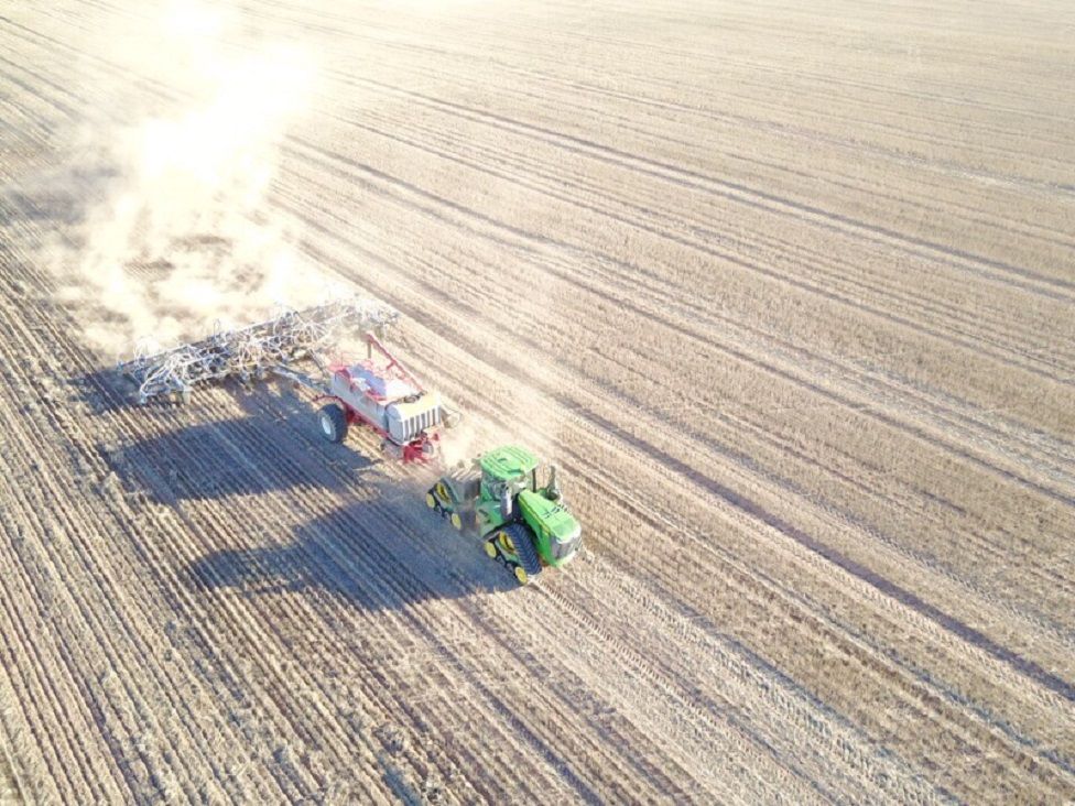 A view of farming equipment seen from a drone's perspective