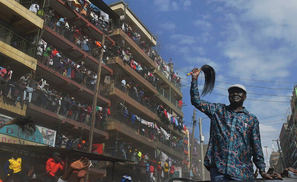 Kenya"s opposition leader Raila Odinga arrives in the Mathare district of Nairobi on August 13, 2017. Kenya"s defeated opposition leader Raila Odinga on August 13 urged his supporters to boycott work, promising to announce on August 15 his strategy after an election he claims was stolen from him