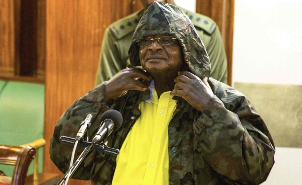 Mr Museveni wears a jacket with a hoodie in parliament