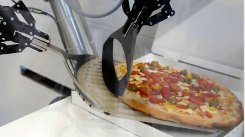 robot making pizza