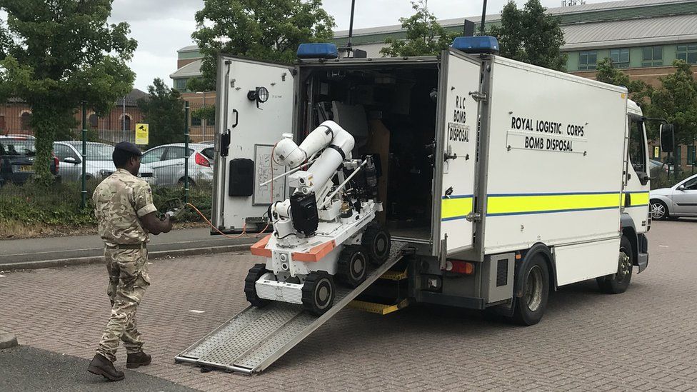 Bomb robot being put back on a van