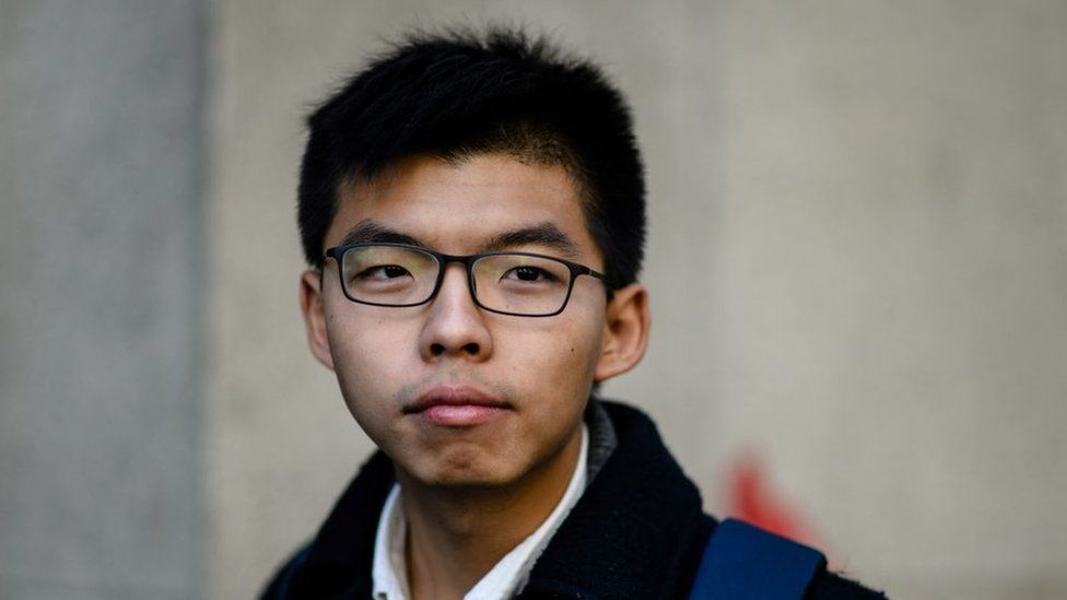 Hong Kong democracy activist Joshua Wong stands outside the Court of Final Appeal