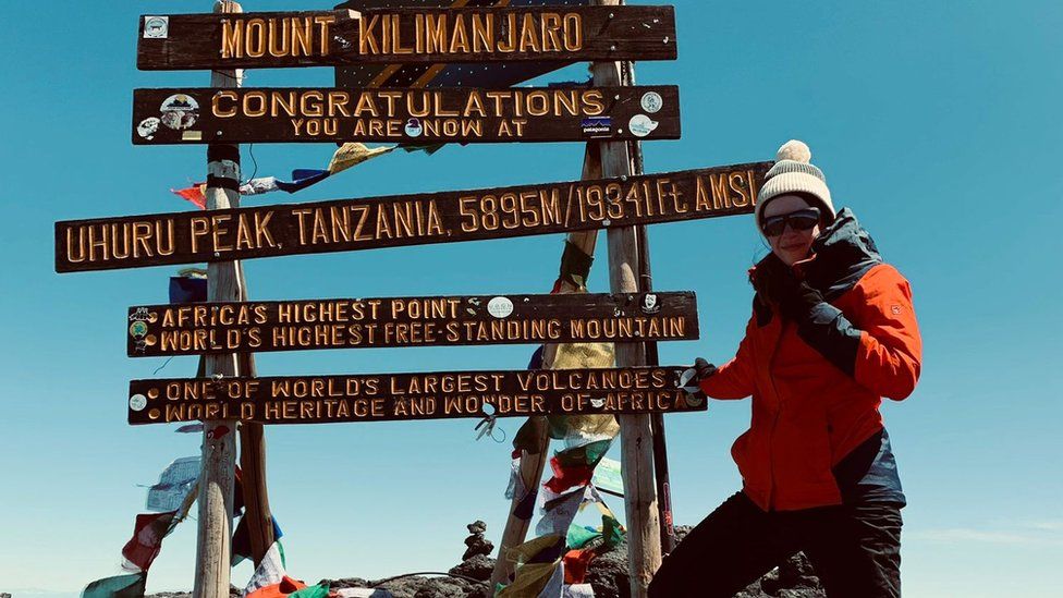 Amanda Walker at the top of Mount Kilimanjaro