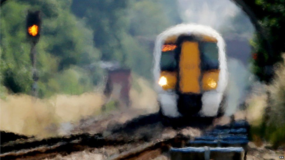 Commuter train seen through a heat haze