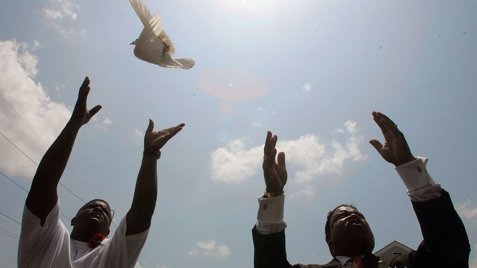 A dove is released after a funeral in New Orleans
