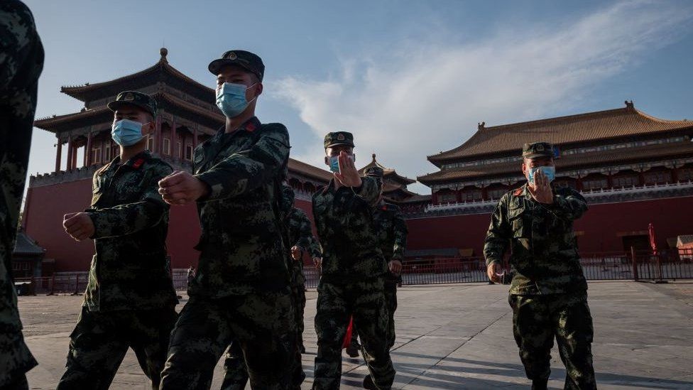 People's Liberation Army (PLA) soldiers march in the Forbidden City in Beijing on May 19, 2020.