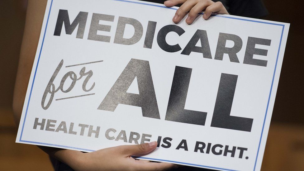 A "Medicare for all" sign.