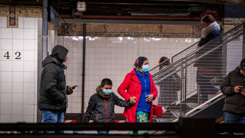 Travellers wear medical masks at Grand Central station on March 5, 2020 in New York City