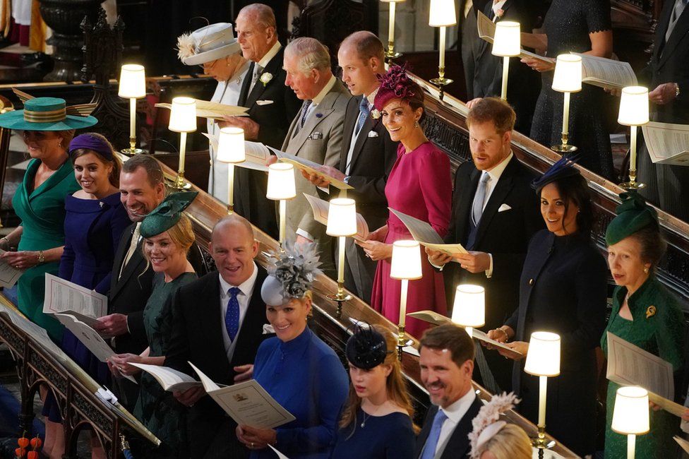 Queen Elizabeth II, the Duke of Edinburgh, the Prince of Wales, the Duke of Cambridge, the Duchess of Cambridge, the Duke of Sussex, the Duchess of Sussex and the Princess Royal, (left to right front row) Sarah Ferguson, Princess Beatrice, Peter Phillips, Autumn Phillips, Mike Tindall, Zara Tindall, Lady Louise Mountbatten-Windsor and Crown Prince Pavlos of Greece at the wedding of Princess Eugenie to Jack Brooksbank at St George's Chapel in Windsor Castle