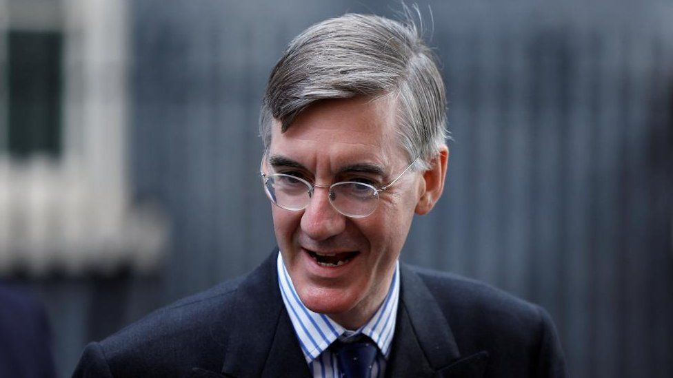 Jacob Rees-Mogg walks outside Number 10 Downing Street, in London,
