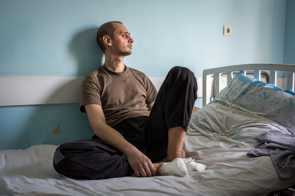 Nikita Horban sits in a medical facility in Zaporizhzhya. "It still hurts," he said. "The wounds are still fresh."