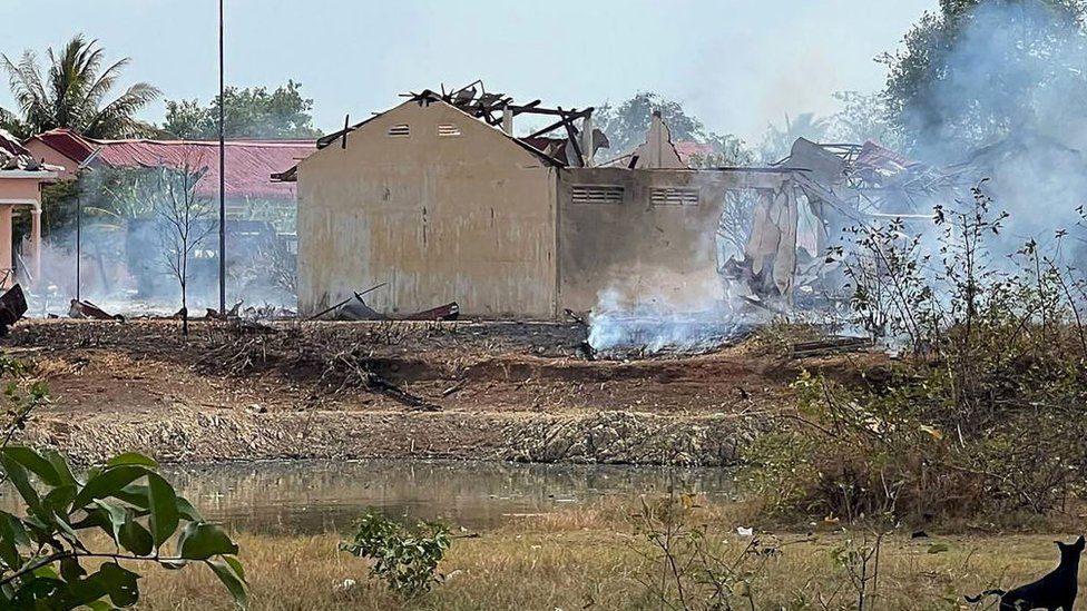 Smoke billows from the warehouse following an explosion at an army base in Kampong Speu province