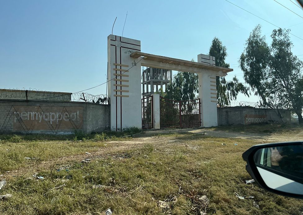 Gate to unfinished orphanage complex