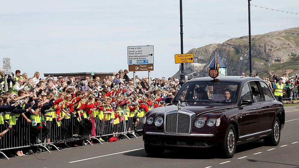 Crowds greet the Queen and Duke of Edinburgh on the seafront of Llandudno, during a two day visit in 2010