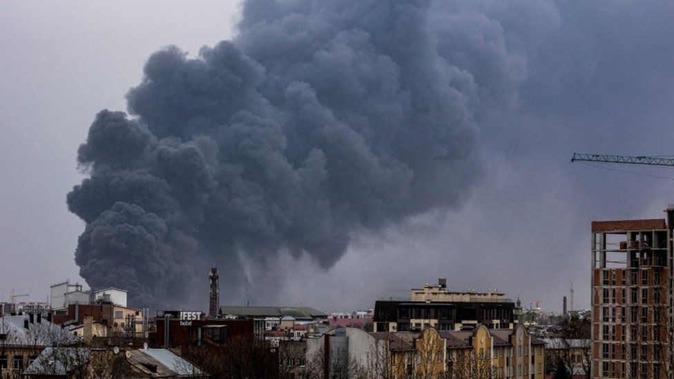 Smoke rises after an airstrike in Lviv