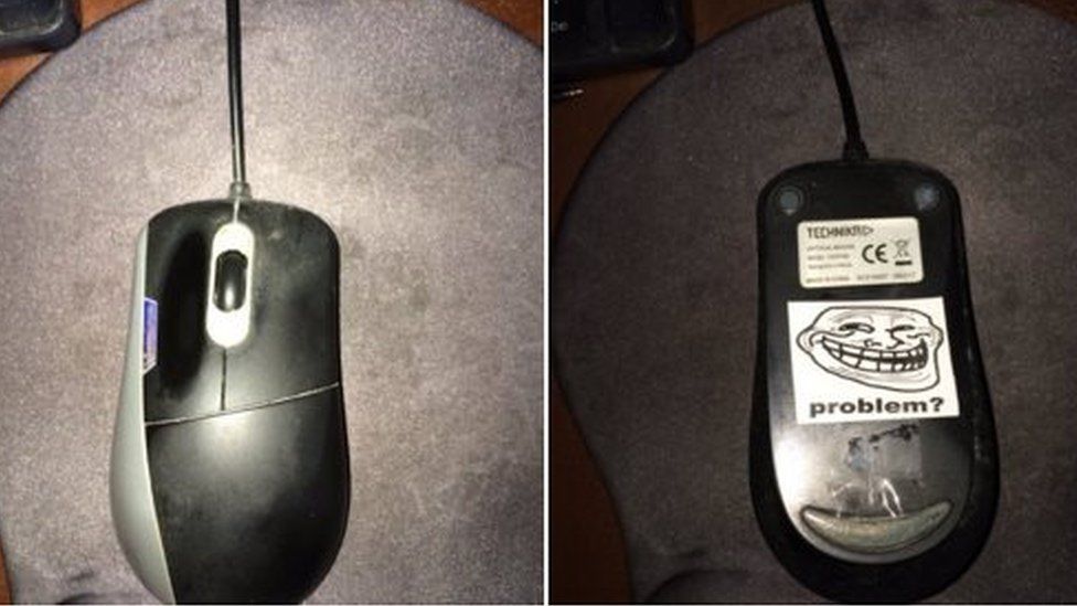 Picture of computer mouse with sticker under it