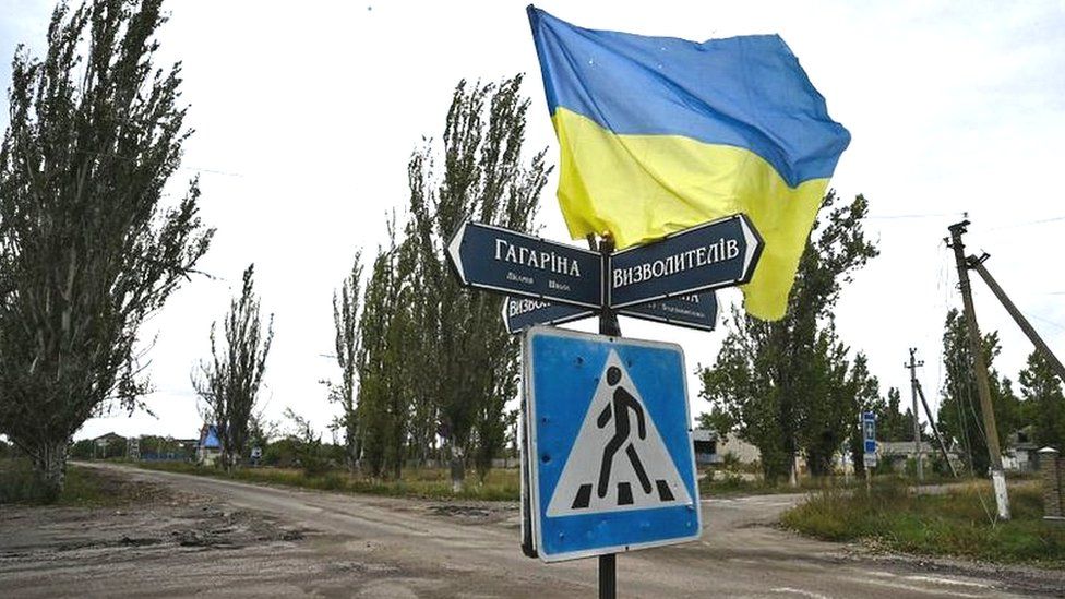 Ukrainian flag waves on a street of the recently liberated village of Vysokopillya, Kherson region