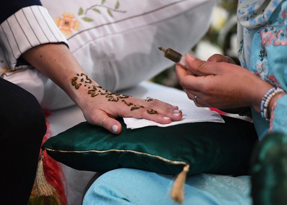 Duchess of Sussex getting henna tattoo