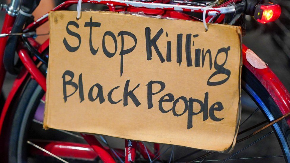 A sign on a bike readers 'Stop killing black people'
