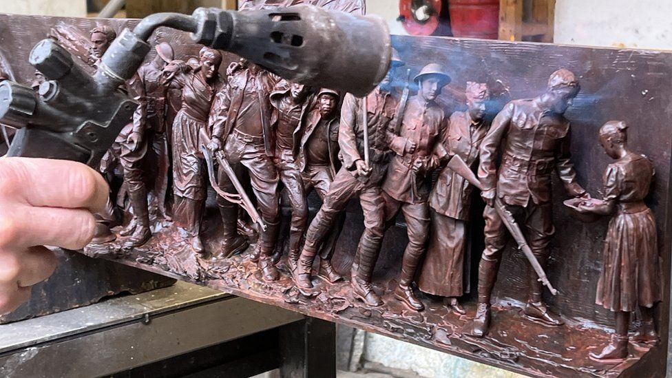 A maquette of soldiers being fired
