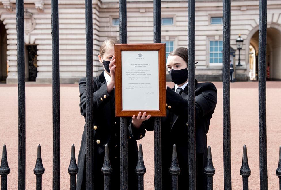 A sign announcing the death of the Britain's Prince Philip, Duke of Edinburgh, who has died at the age of 99, is placed on the gates of Buckingham Palace, in London, Britain 9 April 2021
