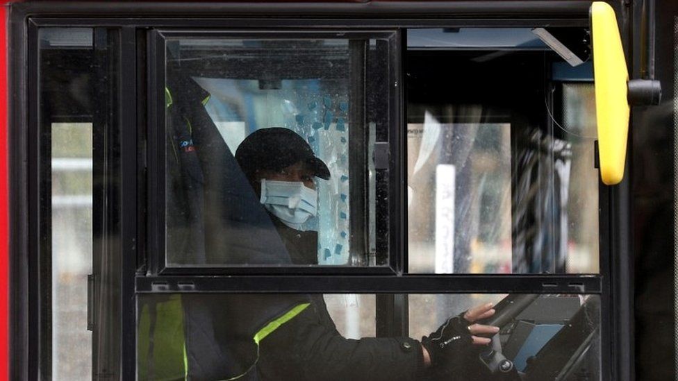 Bus driver with face mask