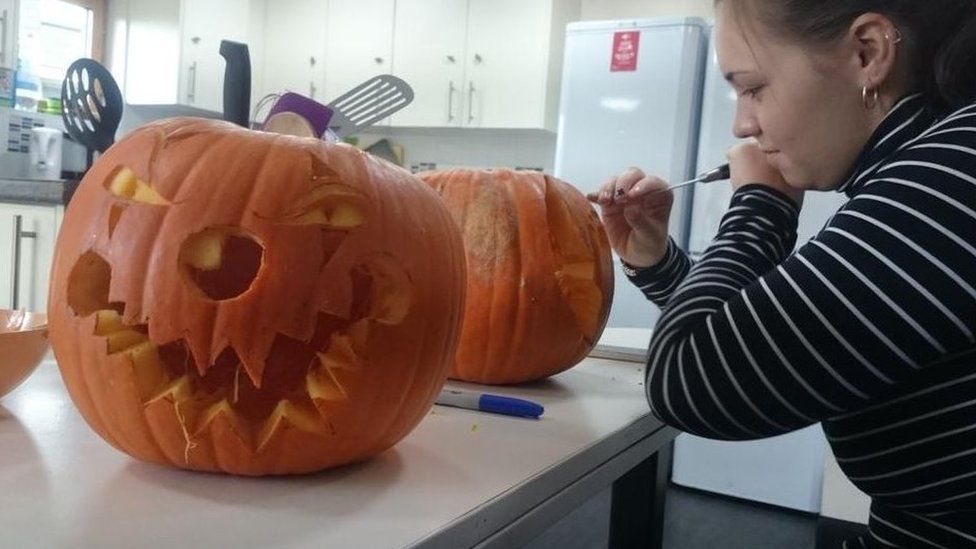Samuel took this picture of his partner Charlie Millard crafting a pumpkin.