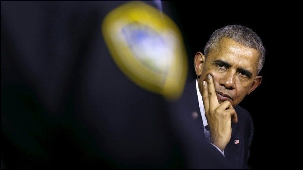 U.S. President Barack Obama listens to remarks while hosting a community discussion on drug addiction during a visit to Charleston, West Virginia October 21, 2015.