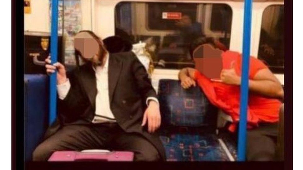 Tinder profile pic of student posing with a sleeping Jewish orthodox man