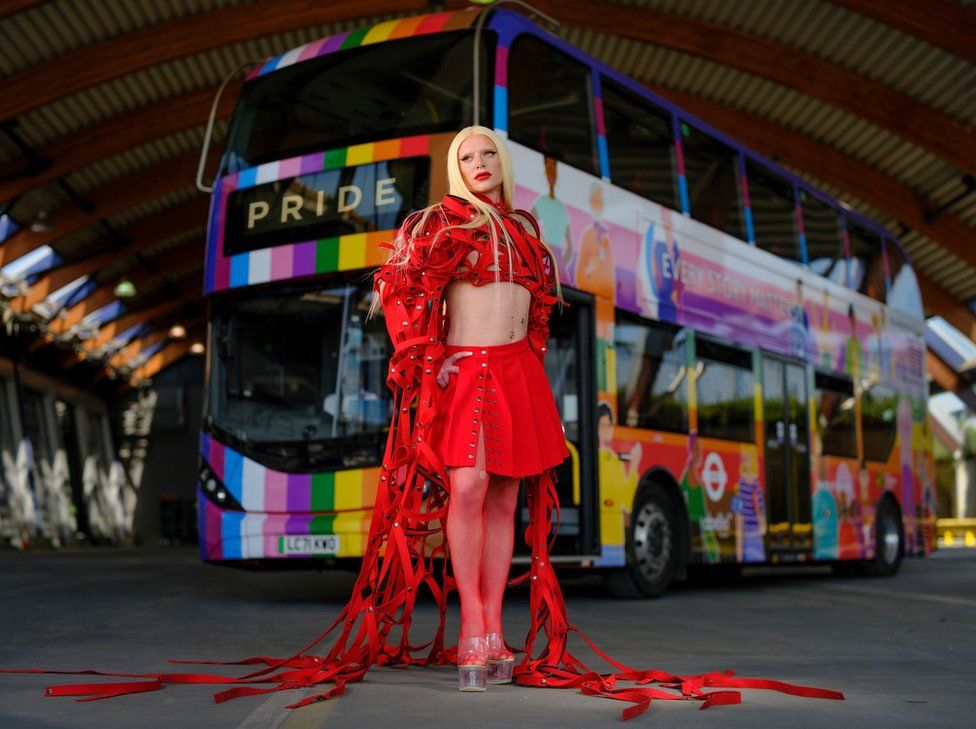 Bimini Bon-Boulash in front of Pride-coloured London bus