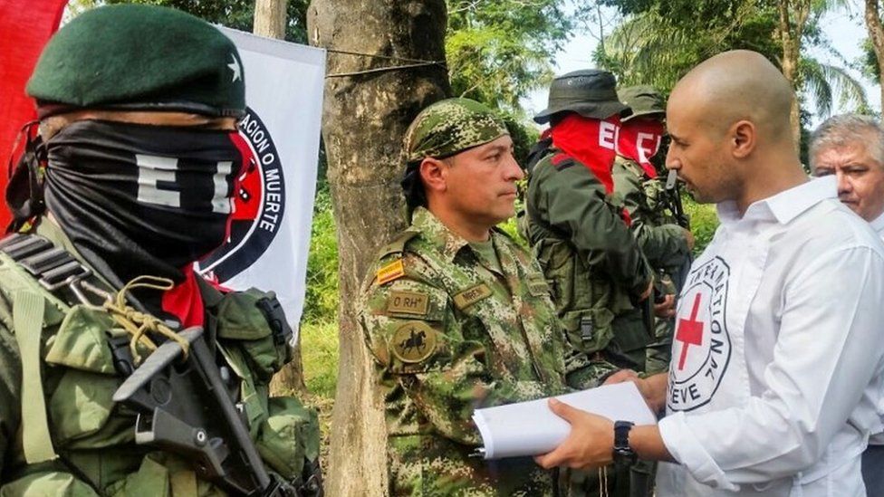 Soldier Freddy Moreno shakes hands with a Red Cross delegate before his release in Arauca