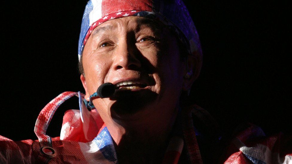Hong Kong singer Sam Hui performs during his concert on February 19, 2005 in Kuala Lumpur, Malaysia.