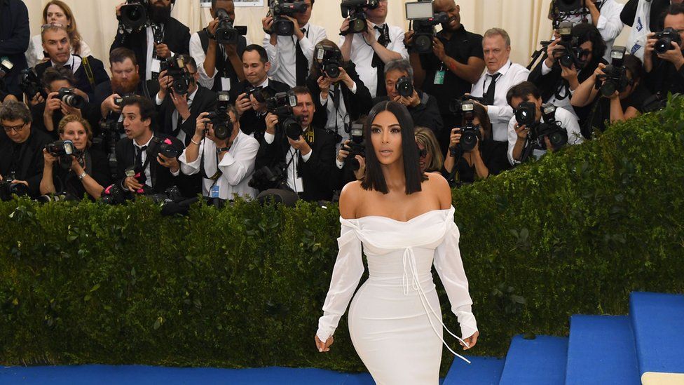 Photographers take Kim's photo at the Met Gala in May 2017