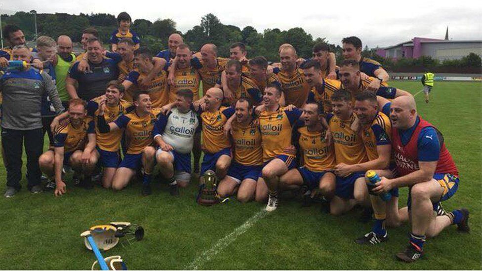 Burt celebrating their 39th county title after a hard fought win over Setanta.