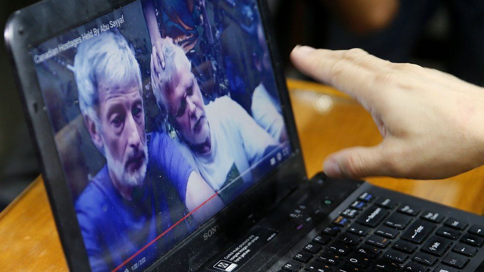 A laptop shows a video allegedly showing hostages of the Abu Sayyaf militant group in the Philippines