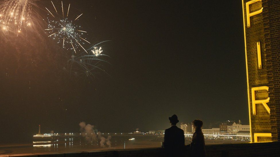 Fireworks exploding above the cinema