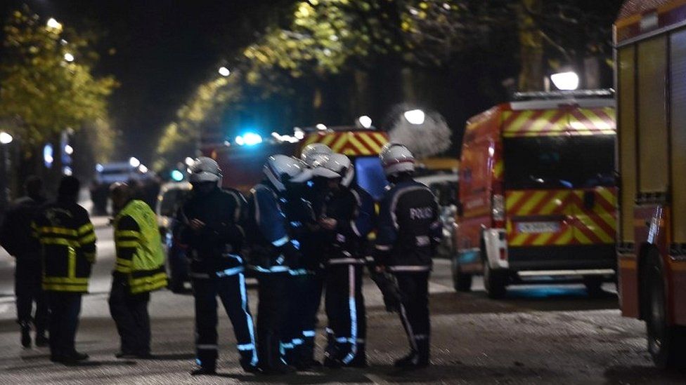 Police cordon off the area close to where armed men have taken hostages in the northern French town of Roubaix