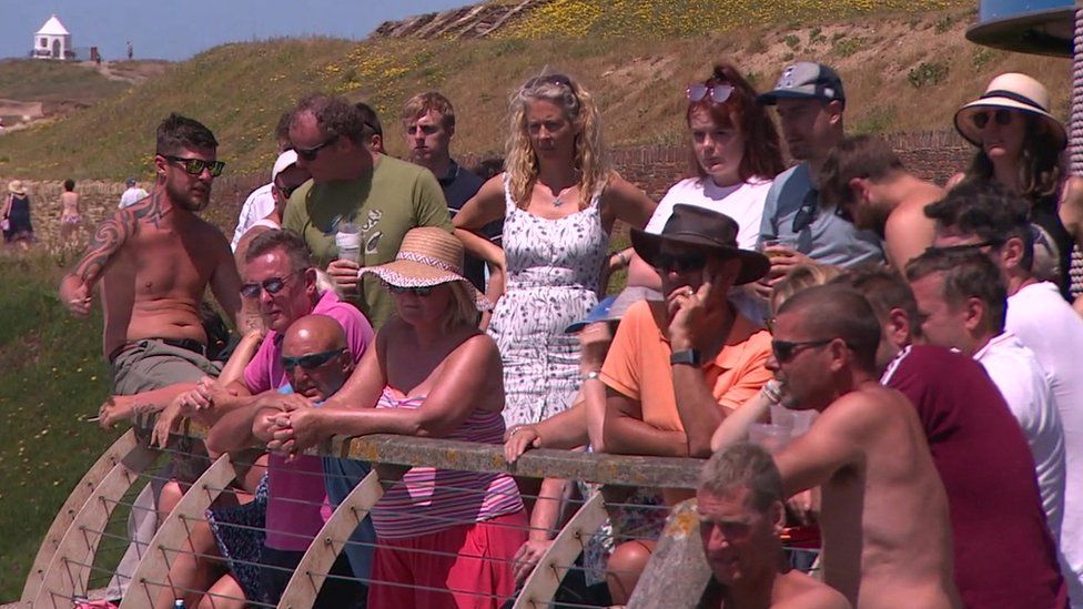 Fans watch big screen on Fistral beach in Newquay, Cornwall