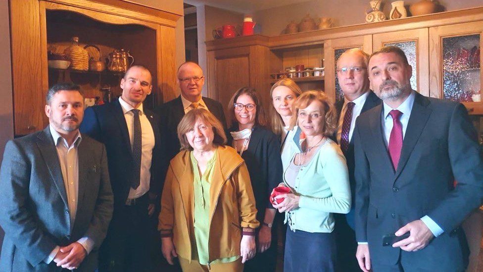 Svetlana Alexievich (centre) surrounded by diplomats at her home in Minsk, Belarus. Photo: September 2020